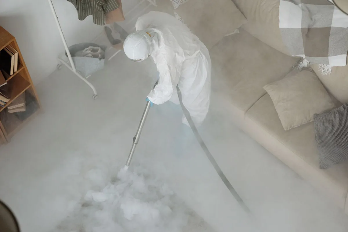 Biohazard cleanup technician in protective equipment, Paw Paw, MI